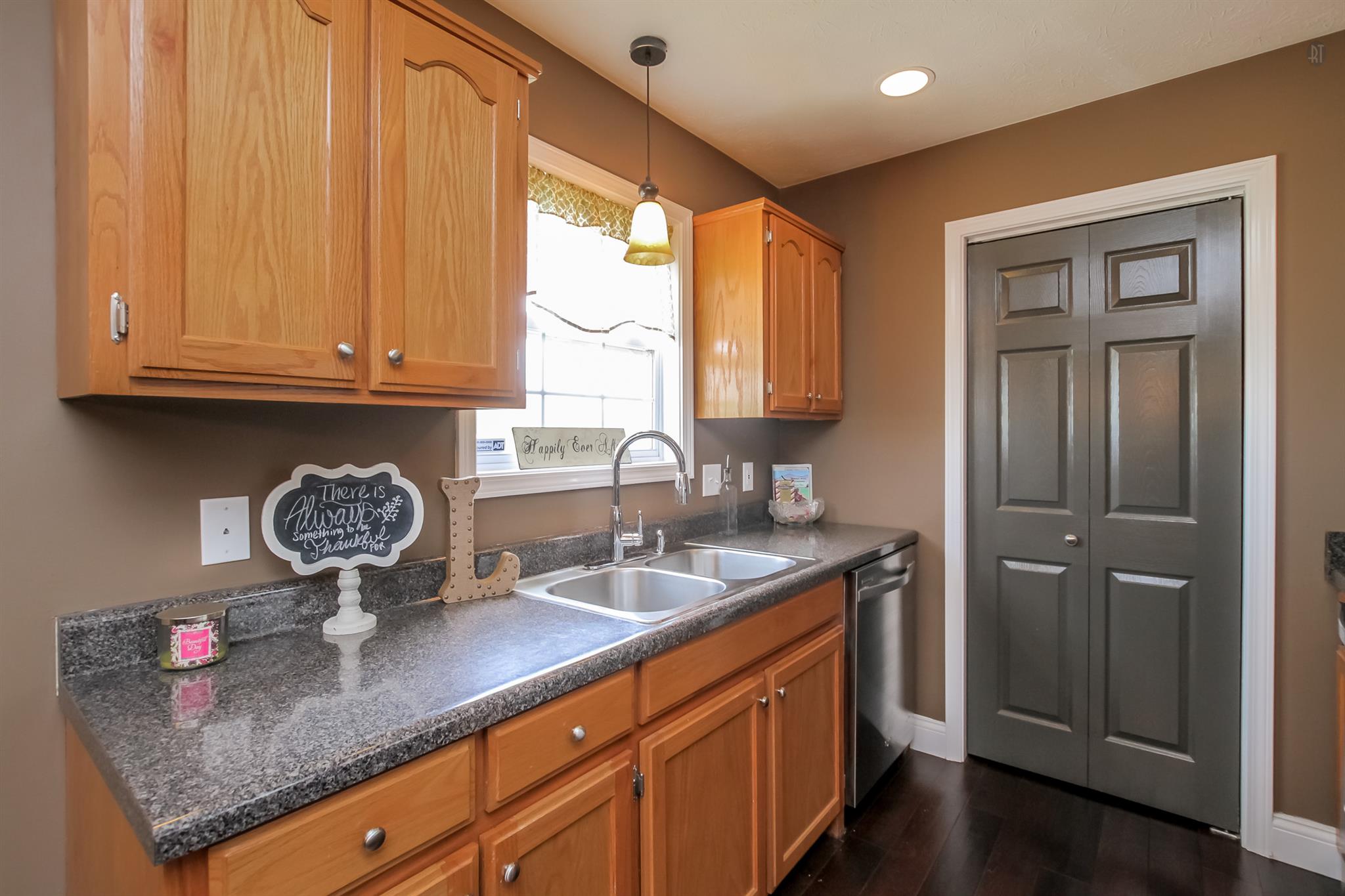 6144 South Lamont Road Springfield, TN 37172 - Photo 7 of 29 a kitchen with stainless steel appliances granite countertop a sink window and cabinets