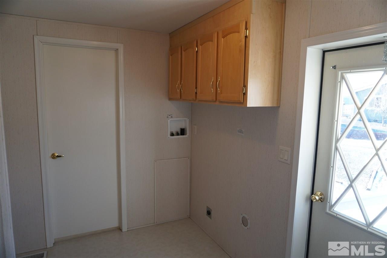 118 Walker Street Gardnerville, NV 89410 - Photo 16 of 20 a bathroom with a sink and a mirror