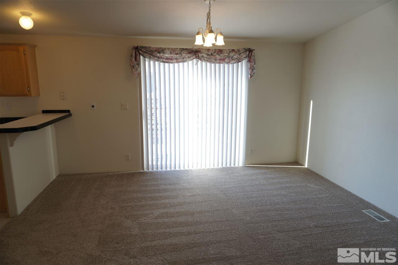 118 Walker Street Gardnerville, NV 89410 - Photo 7 of 20 a view of an empty room with a window