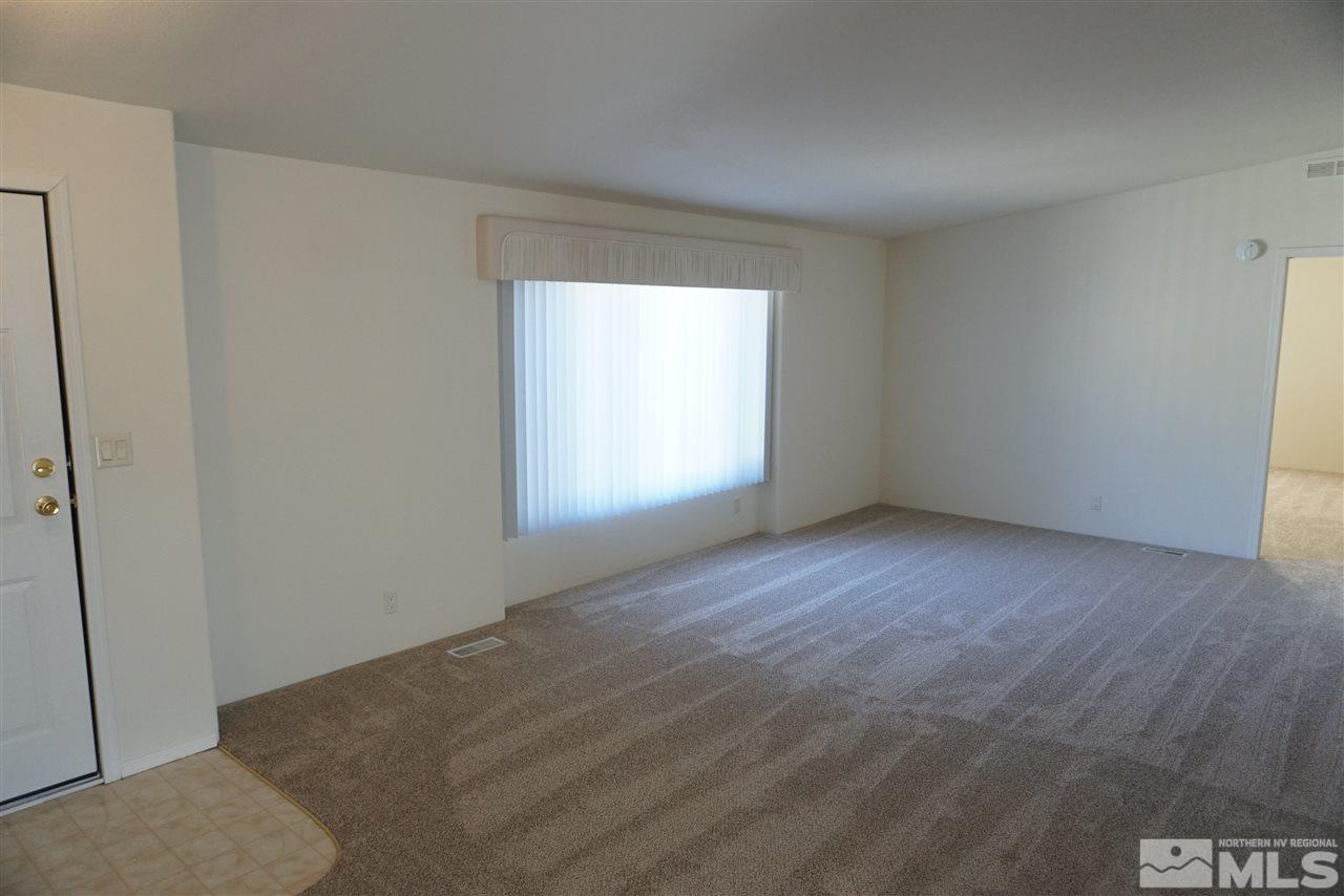 118 Walker Street Gardnerville, NV 89410 - Photo 8 of 20 a view of an empty room with a window