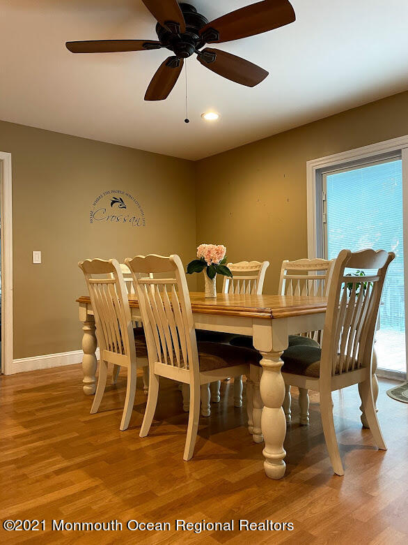 1314 Treeneedle Road Point Pleasant, NJ 08742 - Photo 11 of 62 a view of a dining room with furniture and wooden floor