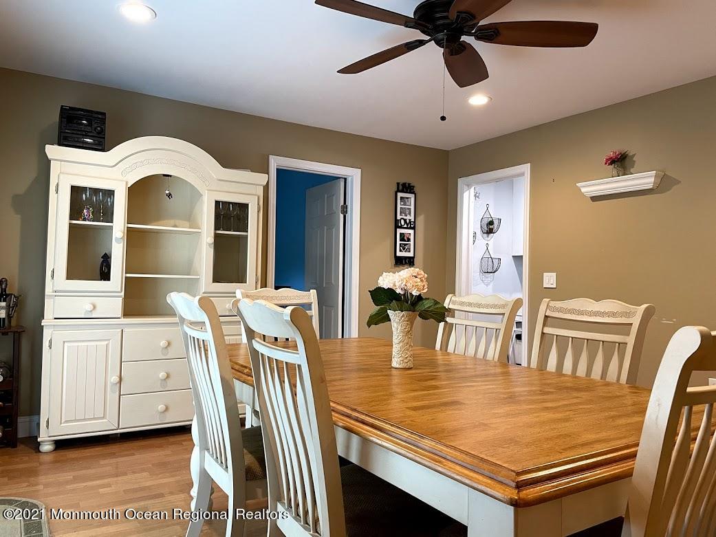 1314 Treeneedle Road Point Pleasant, NJ 08742 - Photo 12 of 62 a view of a dining room with furniture and a chandelier