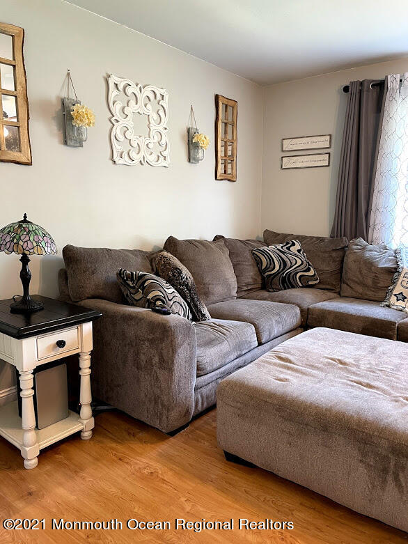 1314 Treeneedle Road Point Pleasant, NJ 08742 - Photo 18 of 62 a living room with furniture and a couch