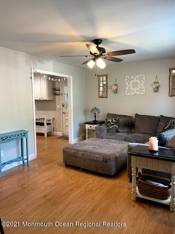 1314 Treeneedle Road Point Pleasant, NJ 08742 - Photo 20 of 62 a living room with furniture and a piano