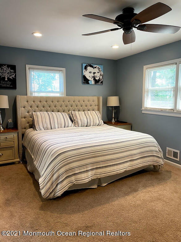 1314 Treeneedle Road Point Pleasant, NJ 08742 - Photo 24 of 62 a bedroom with a bed and a large mirror