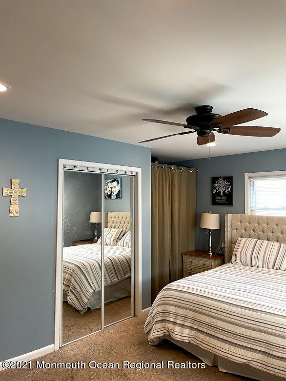 1314 Treeneedle Road Point Pleasant, NJ 08742 - Photo 26 of 62 a bedroom with a bed and a lamp