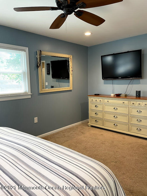 1314 Treeneedle Road Point Pleasant, NJ 08742 - Photo 27 of 62 a bedroom with a bed and flat screen tv