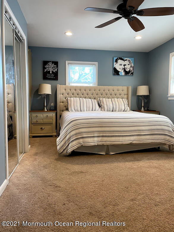 1314 Treeneedle Road Point Pleasant, NJ 08742 - Photo 28 of 62 a spacious bedroom with a bed and a ceiling fan