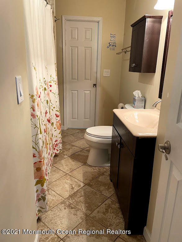 1314 Treeneedle Road Point Pleasant, NJ 08742 - Photo 34 of 62 a bathroom with a sink toilet and shower