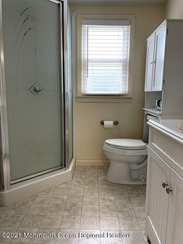 1314 Treeneedle Road Point Pleasant, NJ 08742 - Photo 46 of 62 a bathroom with a toilet and a shower