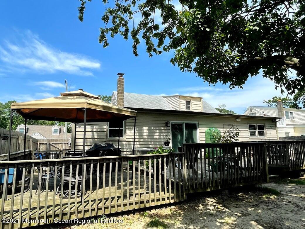 1314 Treeneedle Road Point Pleasant, NJ 08742 - Photo 53 of 62 a view of a house with a deck