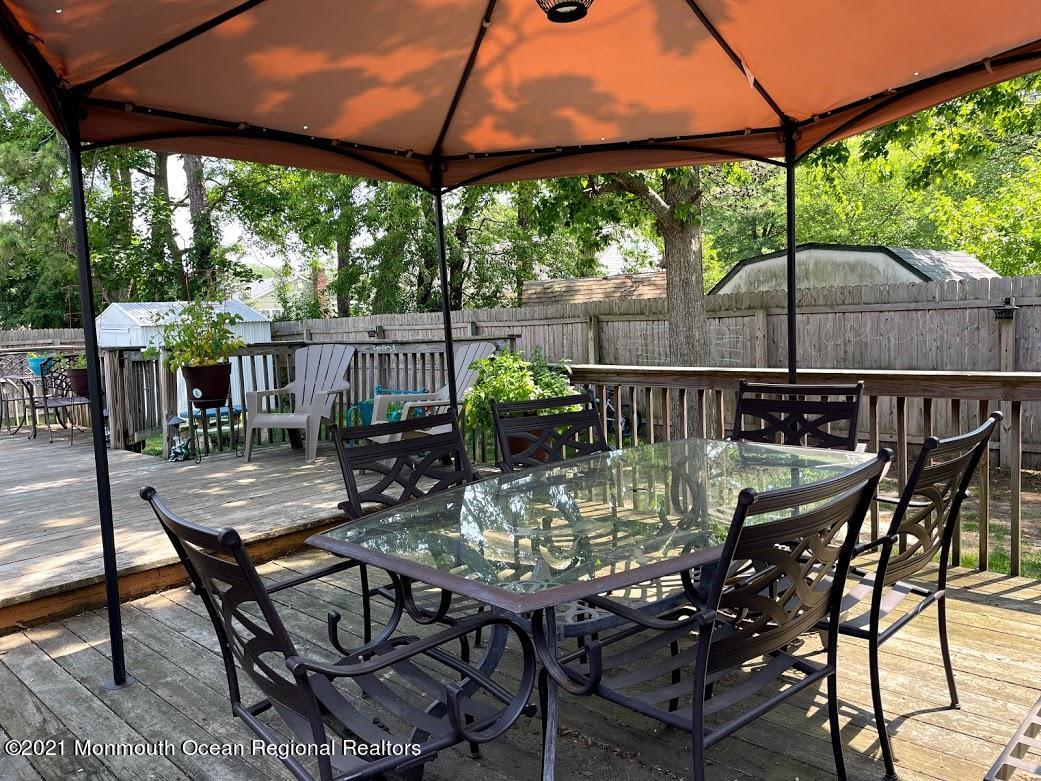1314 Treeneedle Road Point Pleasant, NJ 08742 - Photo 55 of 62 a view of an outdoor dining space with a table and chairs