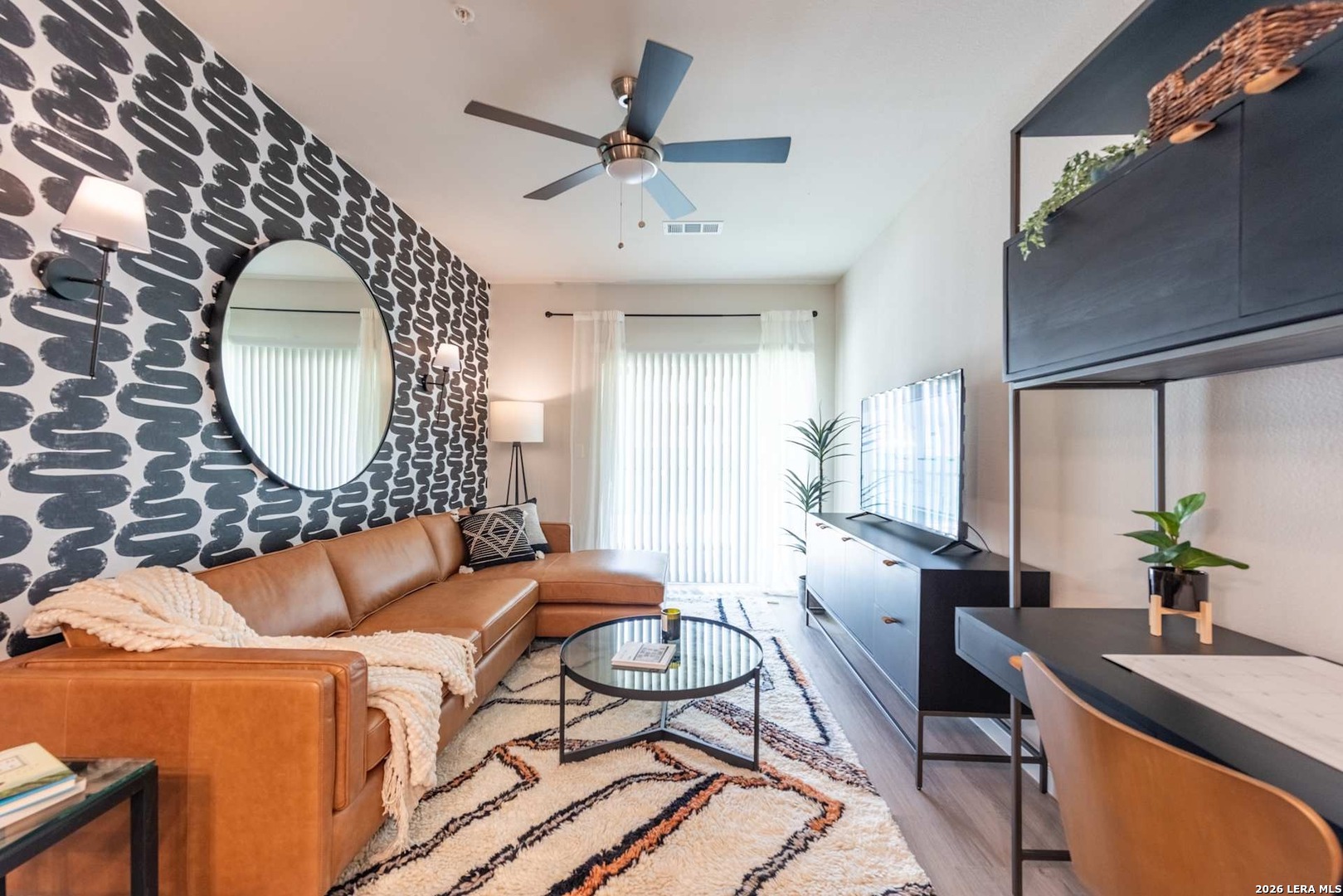 12001 Heatherly, Unit 2202 Austin, TX 78747 - Photo 15 of 15 a living room with furniture and a mirror
