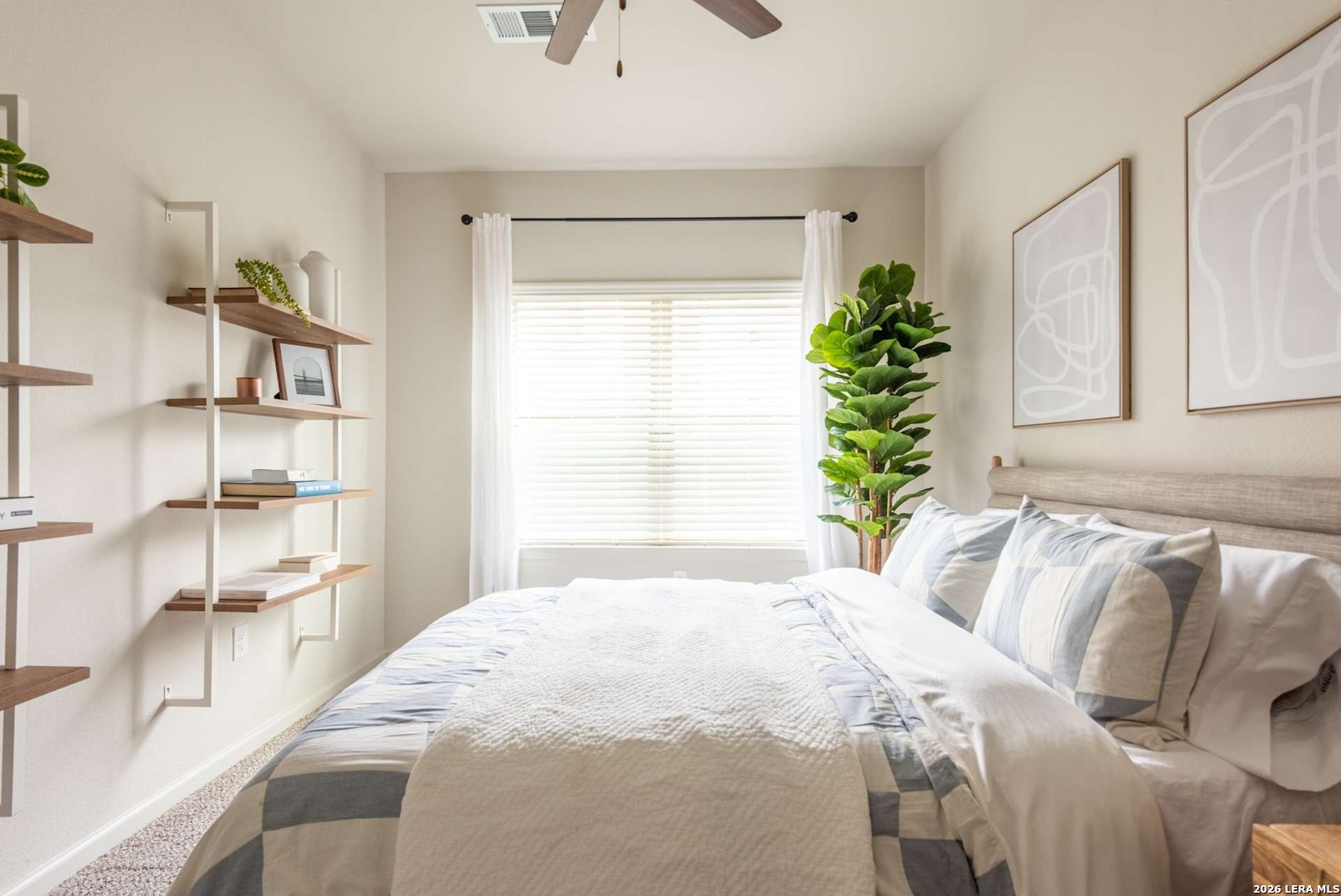 12001 Heatherly, Unit 2202 Austin, TX 78747 - Photo 5 of 15 a bedroom with a bed and a window
