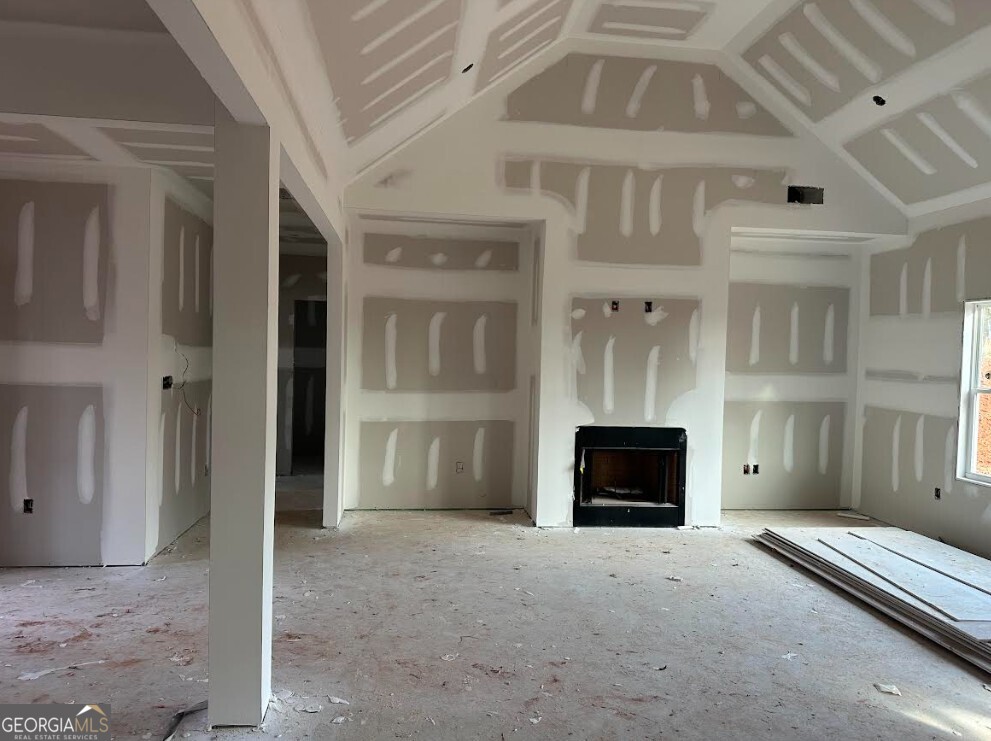 329 Ridgewood Road Jefferson, GA 30549 - Photo 8 of 12 a living room with a fireplace and a ceiling fan