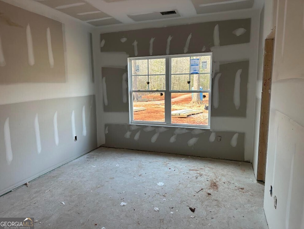 329 Ridgewood Road Jefferson, GA 30549 - Photo 10 of 12 a view of an empty room with a window