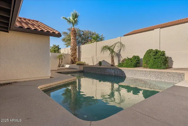 a view of swimming pool with a yard