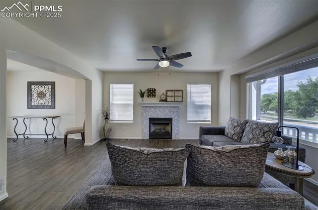 a living room with furniture and a fireplace