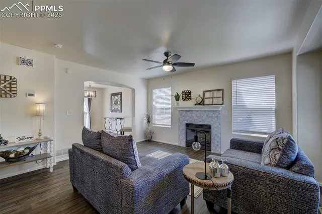 a living room with furniture and a fireplace