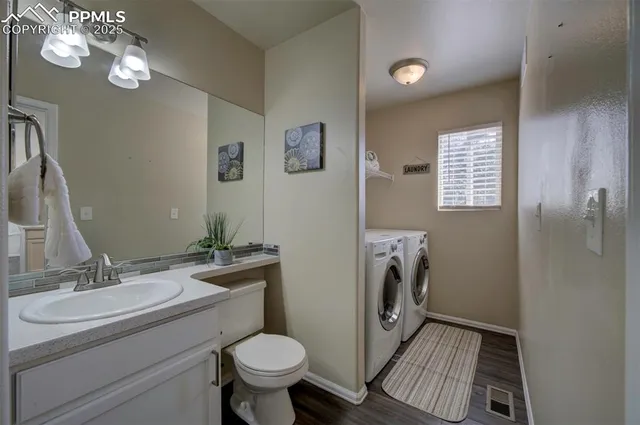 a bathroom with a sink a mirror and a toilet
