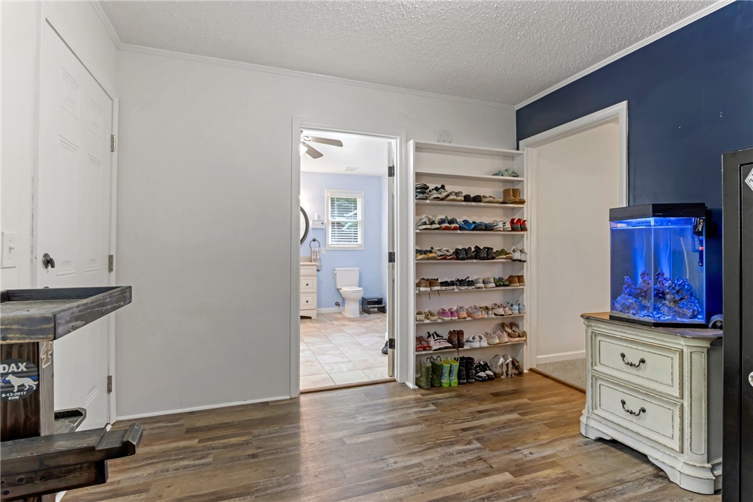 404 Davis Road Liberty, SC 29657 - Photo 25 of 39 A clever built-in shoe rack and wood flooring create a functional and attractive interior space.