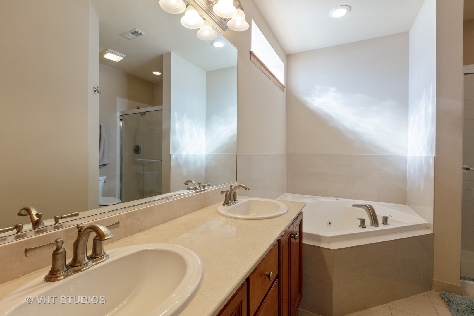 1429 West Fillmore Street, Unit 2 Chicago, IL 60607 - Photo 11 of 14 a bathroom with a sink and a mirror
