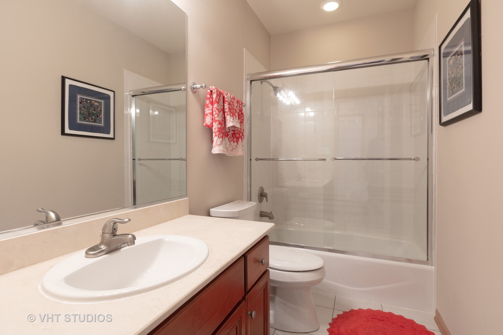 1429 West Fillmore Street, Unit 2 Chicago, IL 60607 - Photo 12 of 14 a bathroom with a sink toilet and shower