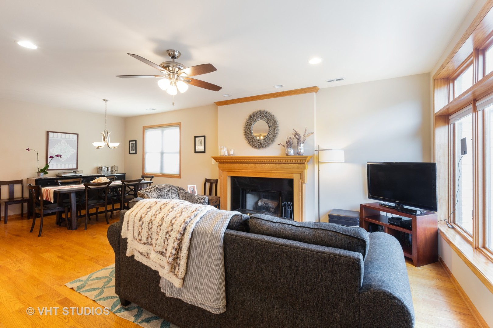 1429 West Fillmore Street, Unit 2 Chicago, IL 60607 - Photo 4 of 14 a living room with furniture a fireplace and a flat screen tv