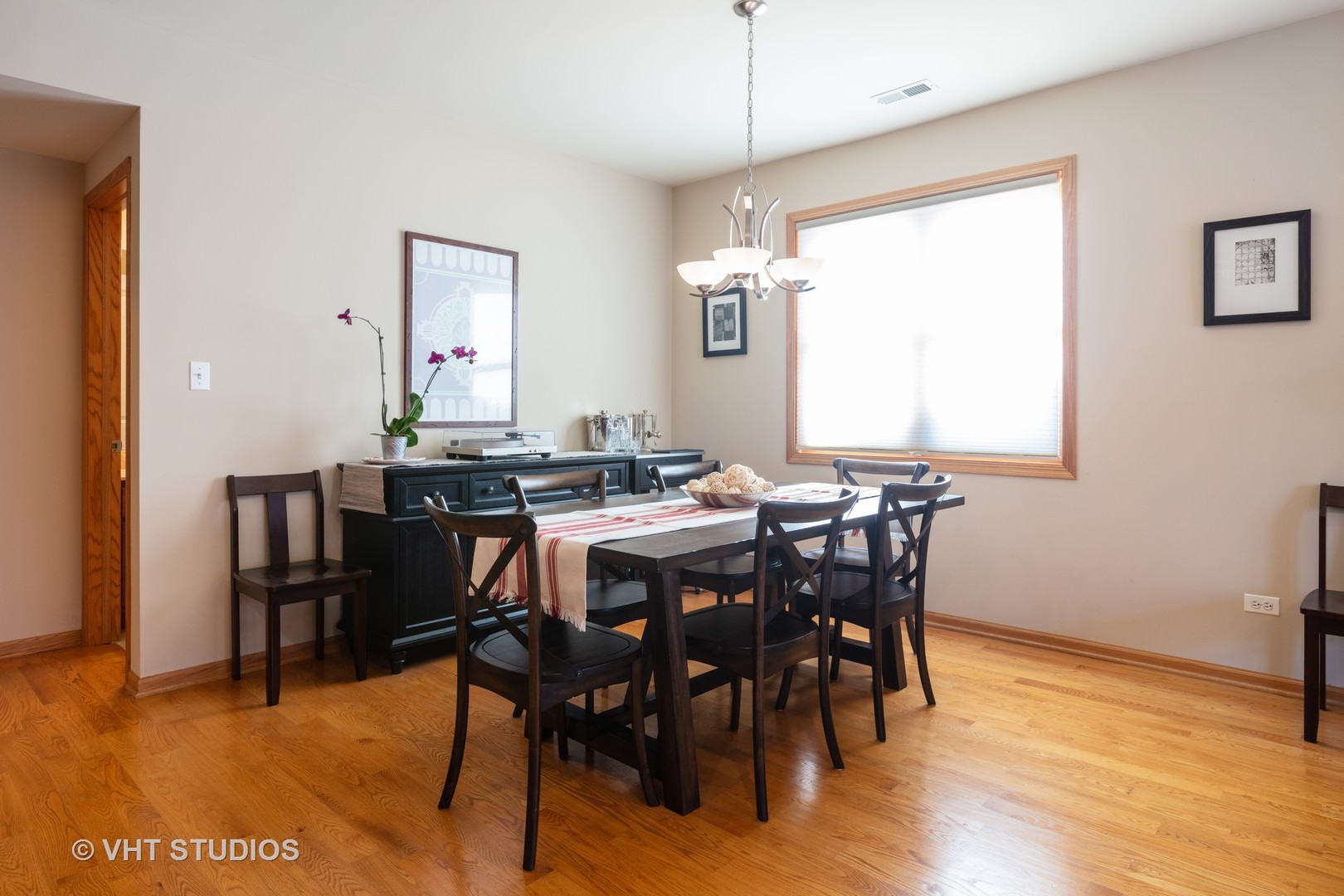 1429 West Fillmore Street, Unit 2 Chicago, IL 60607 - Photo 8 of 14 a view of a dining room with furniture and wooden floor