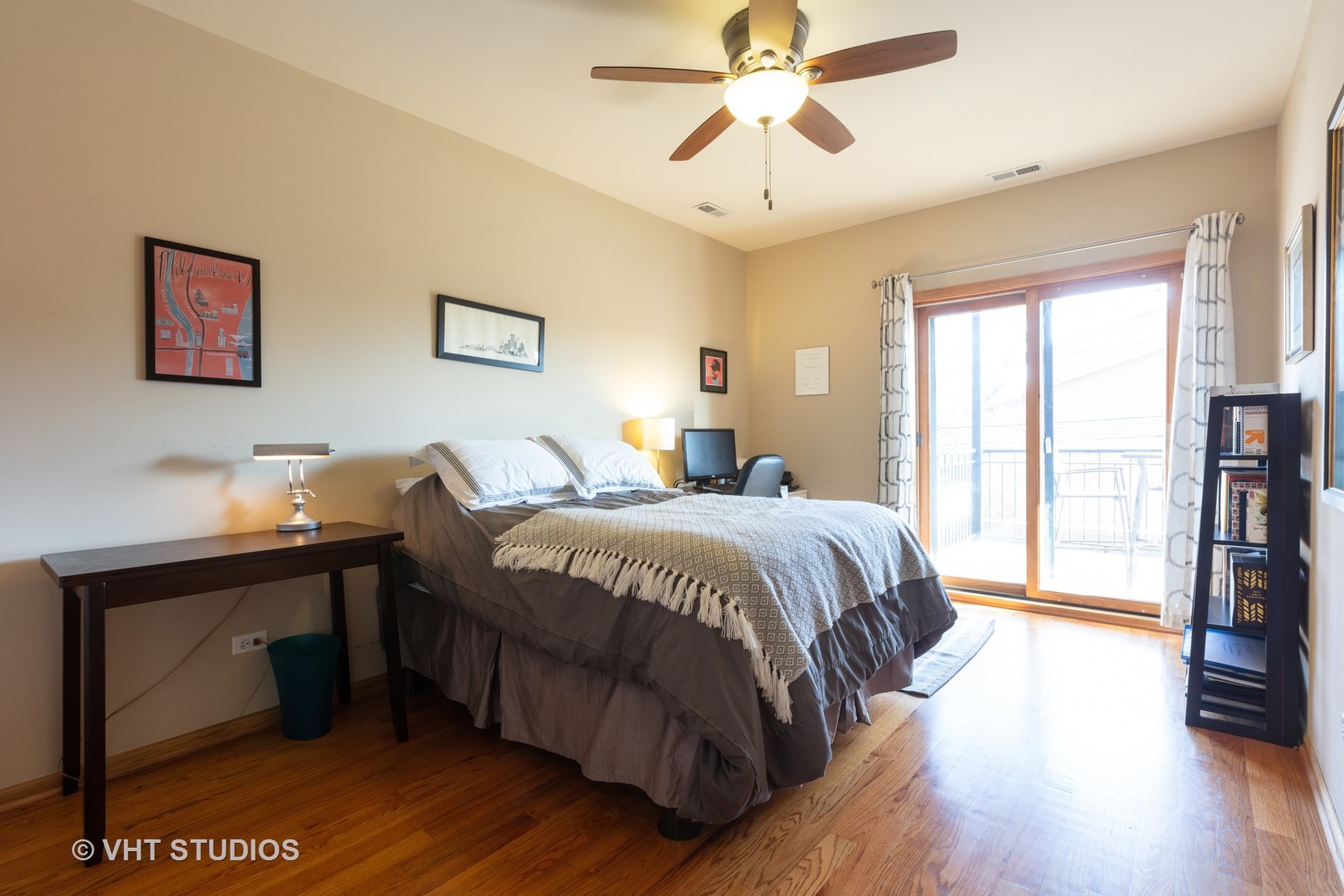 1429 West Fillmore Street, Unit 2 Chicago, IL 60607 - Photo 10 of 14 a bedroom with a bed and a tv on the dresser