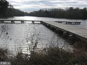 63 Elm Drive Colonial Beach, VA 22443 - Photo 5 of 7 a view of a pathway with a yard