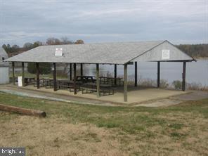 63 Elm Drive Colonial Beach, VA 22443 - Photo 6 of 7 a view of a big house with a big yard and large tree