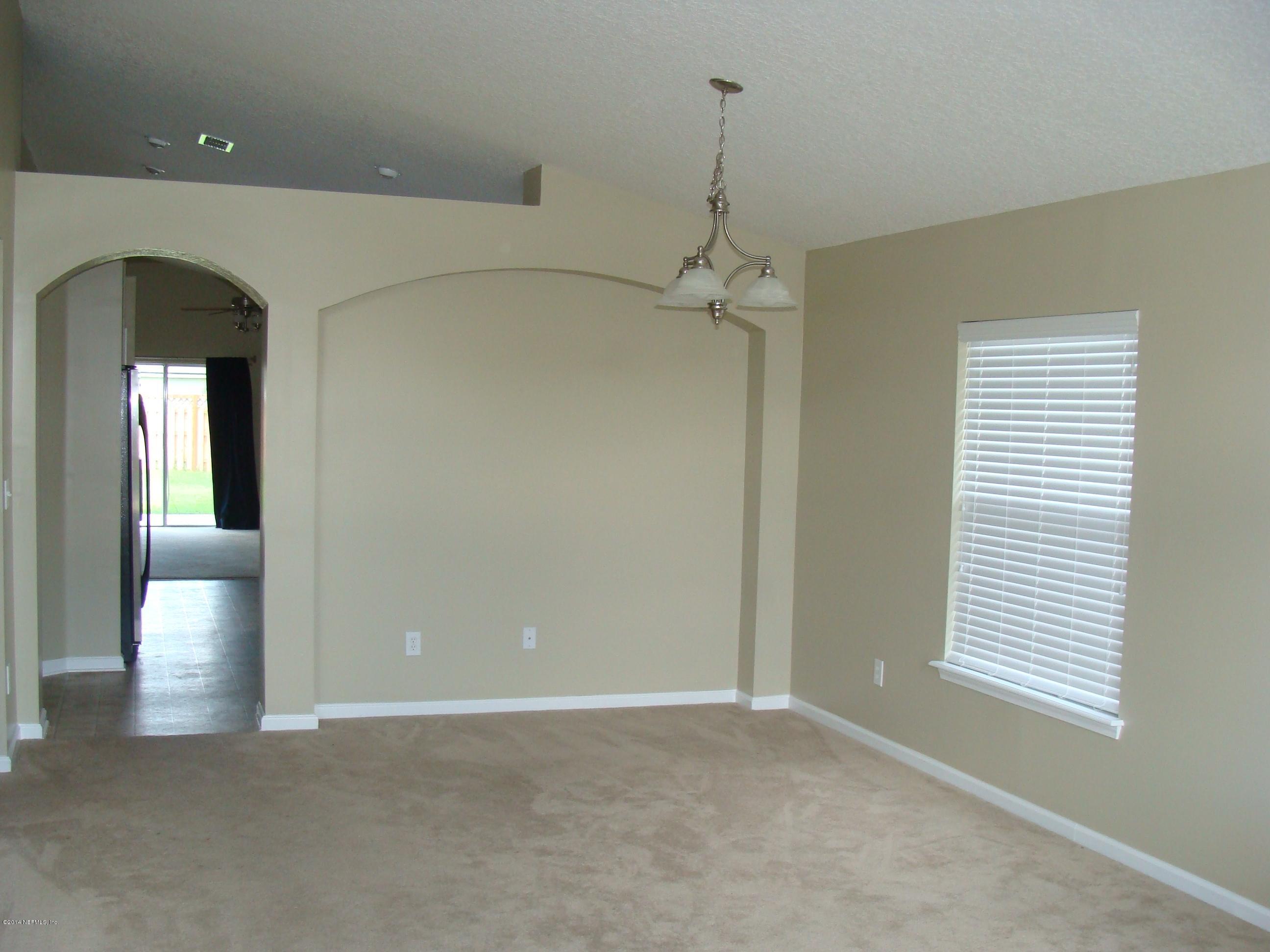 840 Crystal Spring Way St. Augustine, FL 32092 - Photo 2 of 6 a view of a room with a walk in closet and window