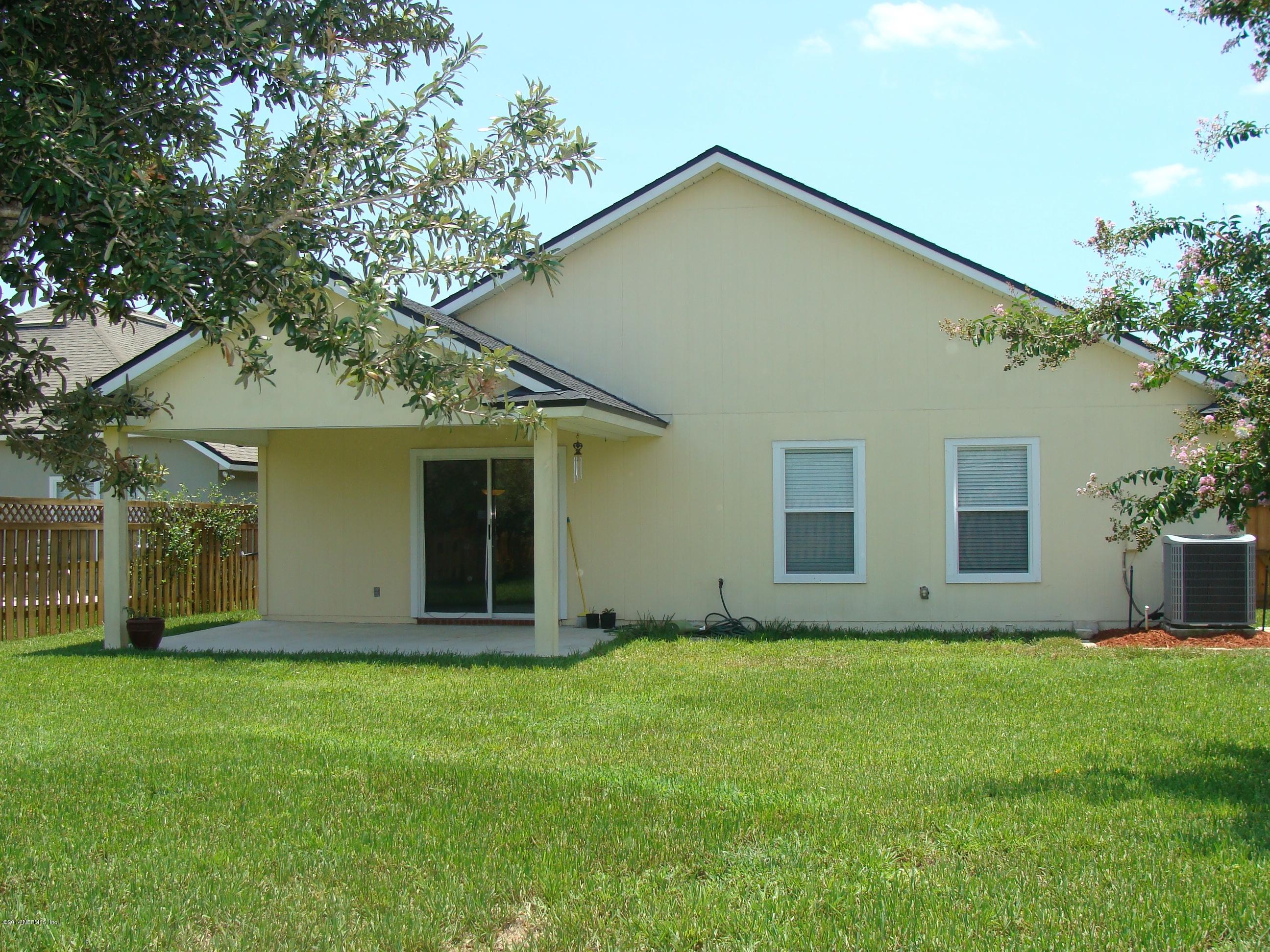 840 Crystal Spring Way St. Augustine, FL 32092 - Photo 5 of 6 front view of house with a yard