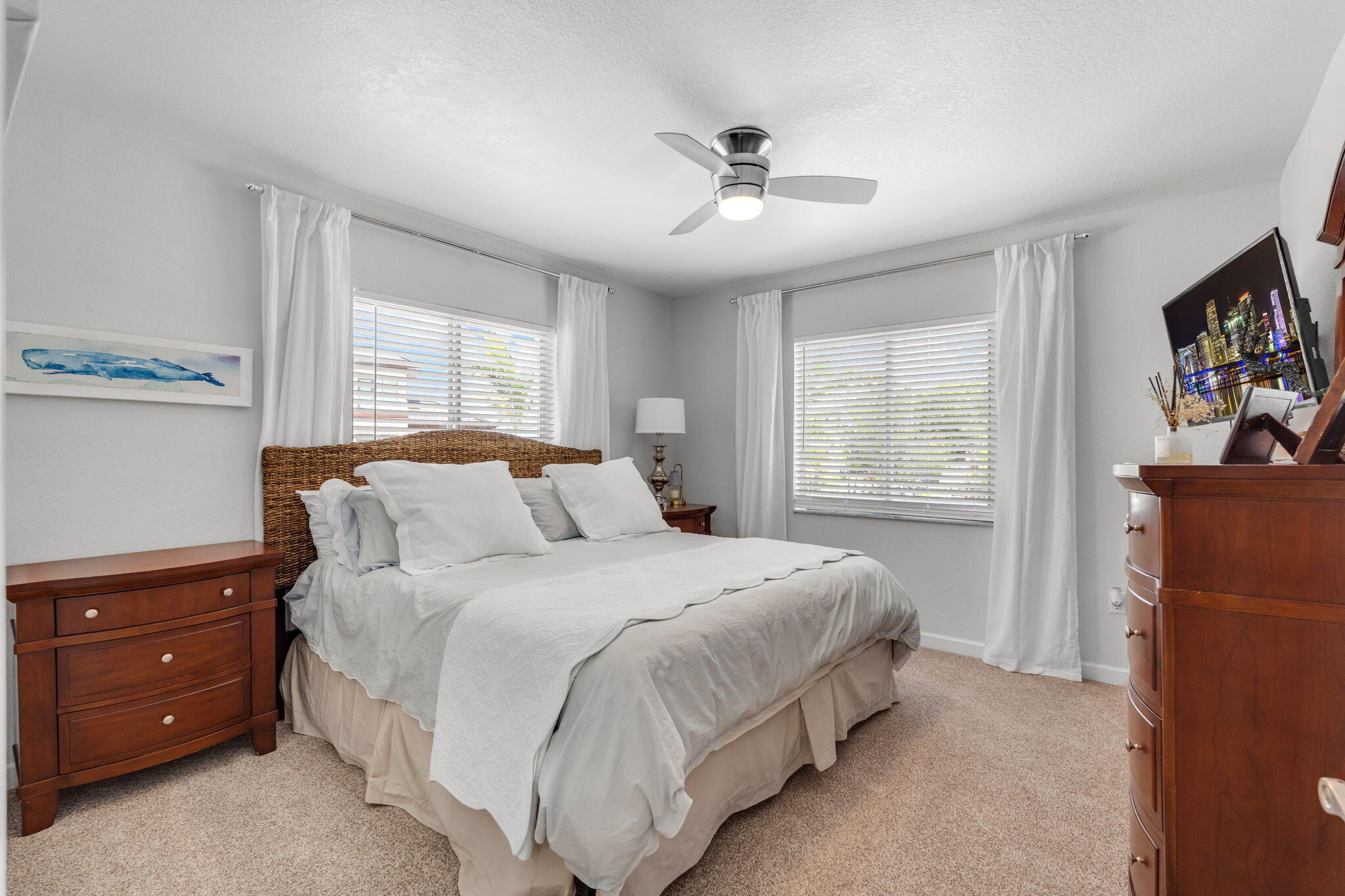 24 Mutiny Place Key Largo, FL 33037 - Photo 31 of 69 a bedroom with a bed and a chandelier