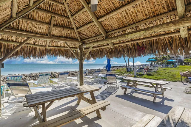 a view of swimming pool with sitting area