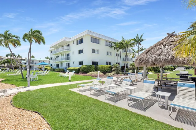 a view of a patio with a table and chairs
