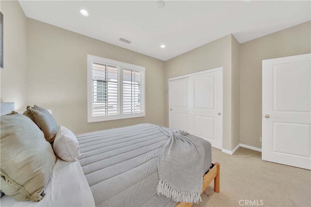 75 Gardenstone Path Irvine, CA 92620 - Photo 34 of 65 a bedroom with a bed and window