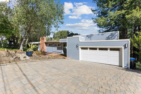 a view of a house with a snow in the yard