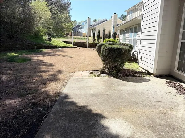 a view of a backyard with sitting area