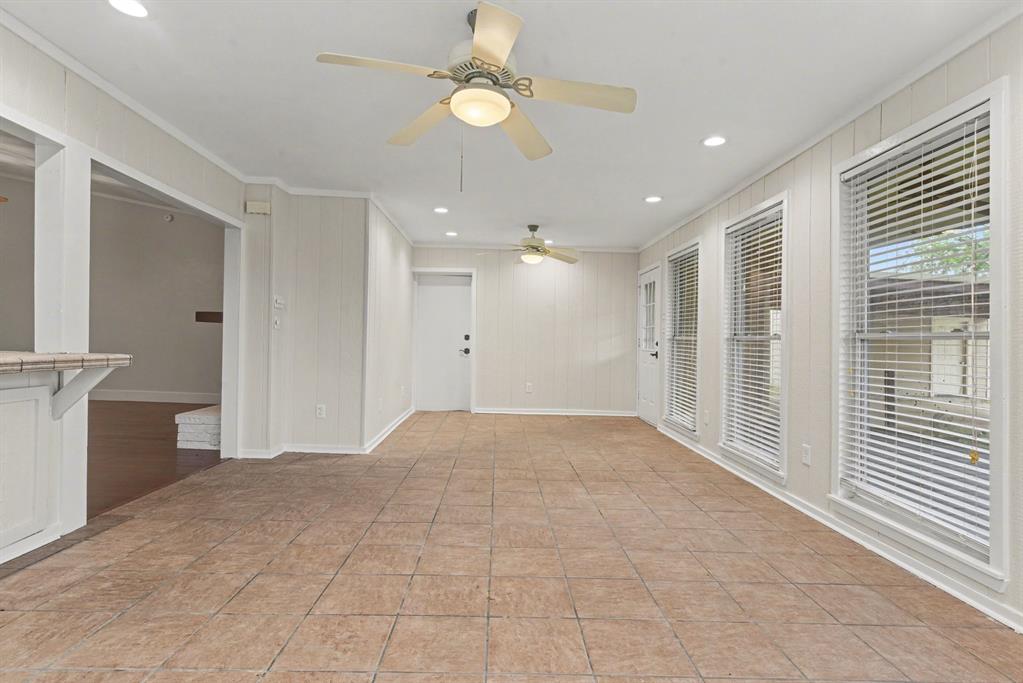 5926 Rosehill Road Garland, TX 75043 - Photo 11 of 26 a view of empty room with a ceiling fan