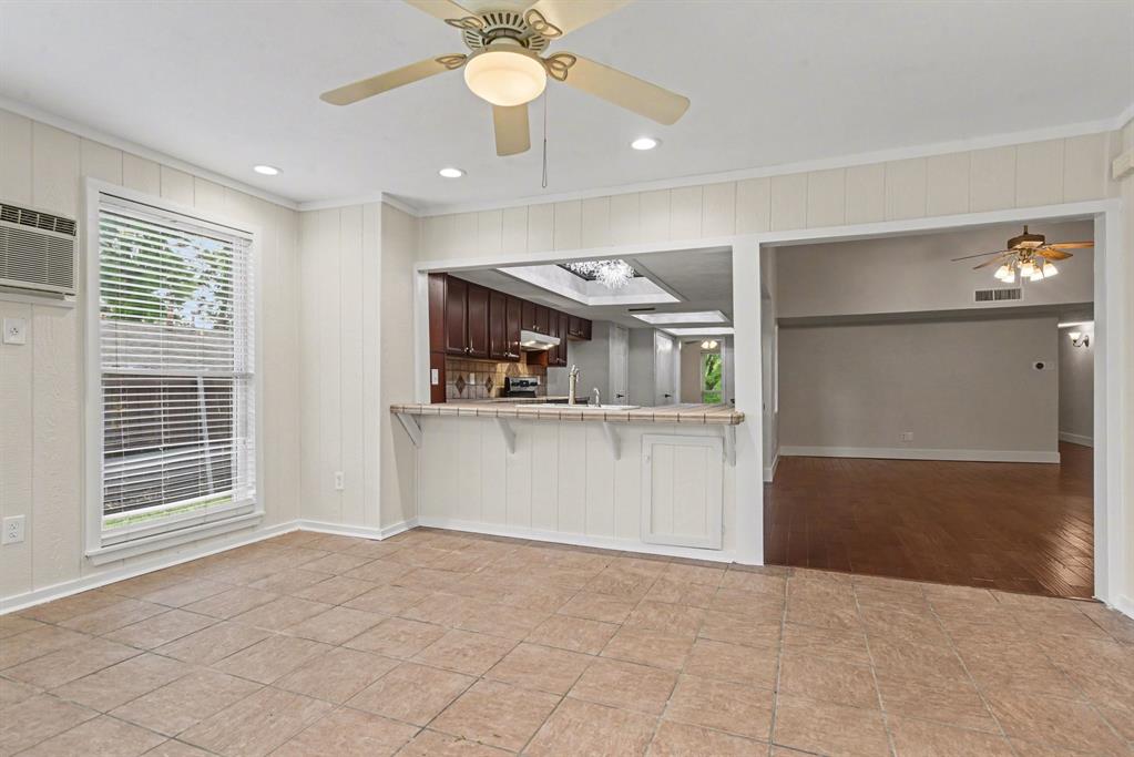 5926 Rosehill Road Garland, TX 75043 - Photo 12 of 26 a view of a kitchen with a sink and a large window