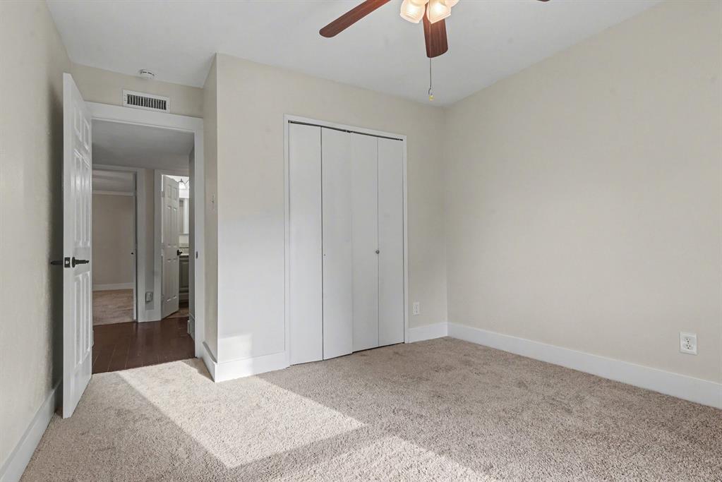 5926 Rosehill Road Garland, TX 75043 - Photo 20 of 26 an empty room with fan and entrance