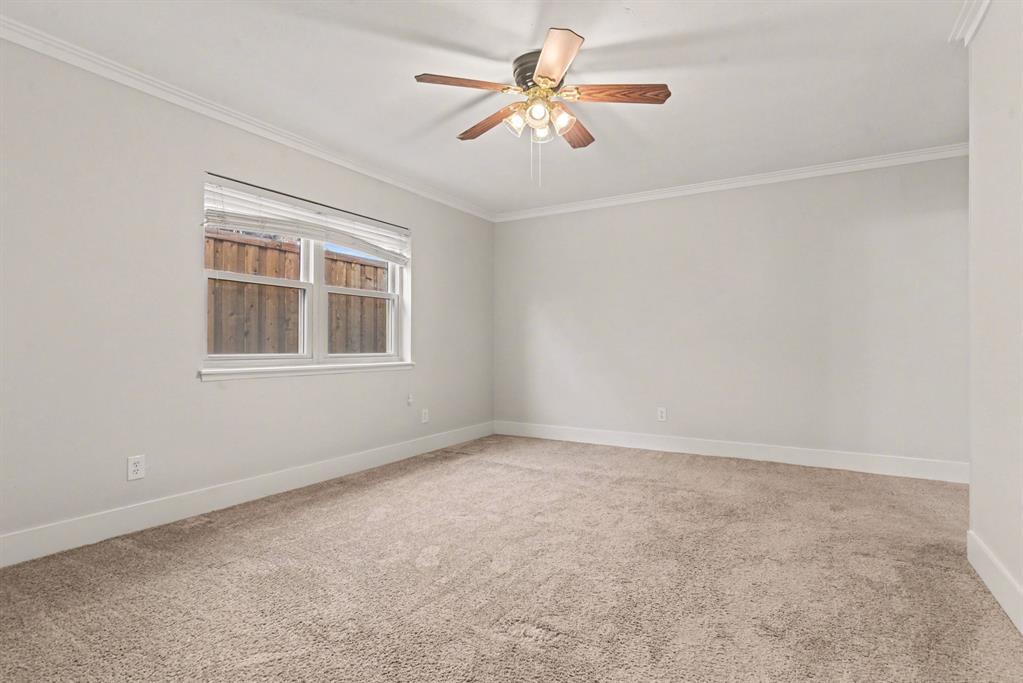 5926 Rosehill Road Garland, TX 75043 - Photo 21 of 26 a view of an empty room with a window