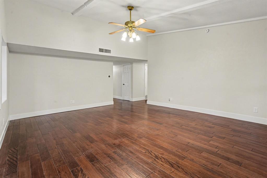 5926 Rosehill Road Garland, TX 75043 - Photo 5 of 26 a view of an empty room with wooden floor