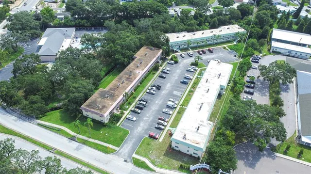 an aerial view of residential houses with city view