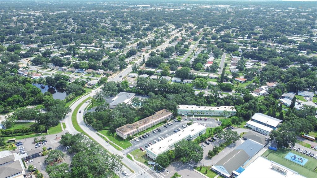 2003 Greenbriar Boulevard, Unit 16 Clearwater, FL 33763 - Photo 31 of 56 an aerial view of residential house with outdoor space