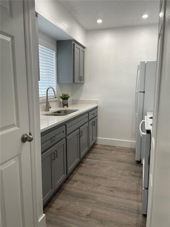2003 Greenbriar Boulevard, Unit 16 Clearwater, FL 33763 - Photo 37 of 56 a bathroom with a sink a toilet and mirror