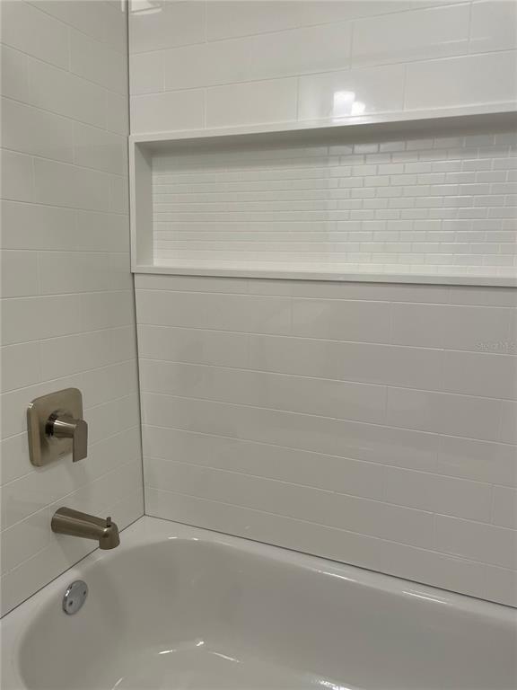 2003 Greenbriar Boulevard, Unit 16 Clearwater, FL 33763 - Photo 46 of 56 a bathroom with a bathtub