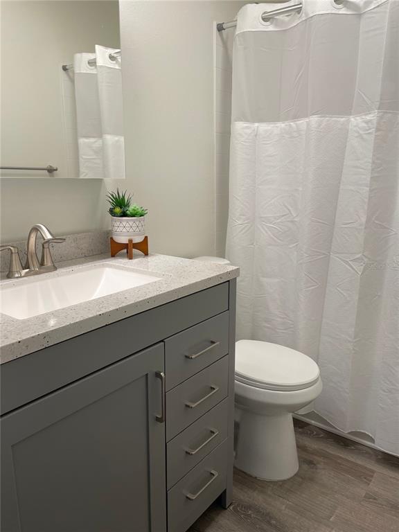 2003 Greenbriar Boulevard, Unit 16 Clearwater, FL 33763 - Photo 47 of 56 a bathroom with a sink toilet and mirror